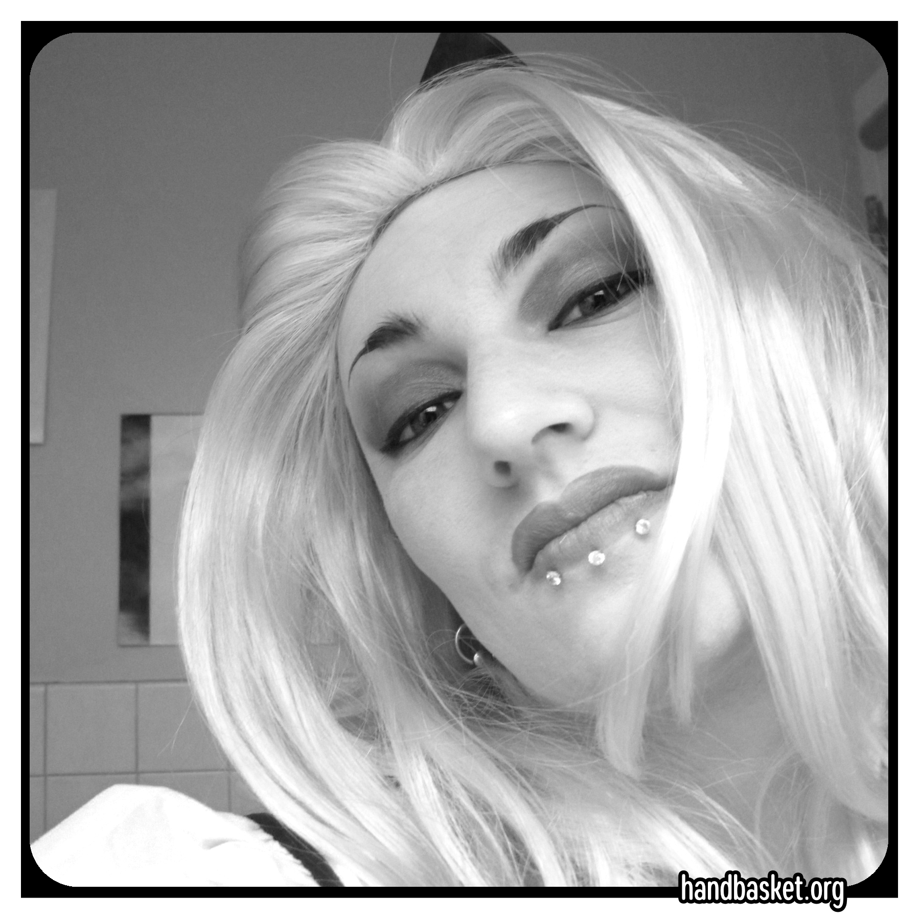 Photo of me in fancy makeup and a blonde wig that has actually not had a blow-out