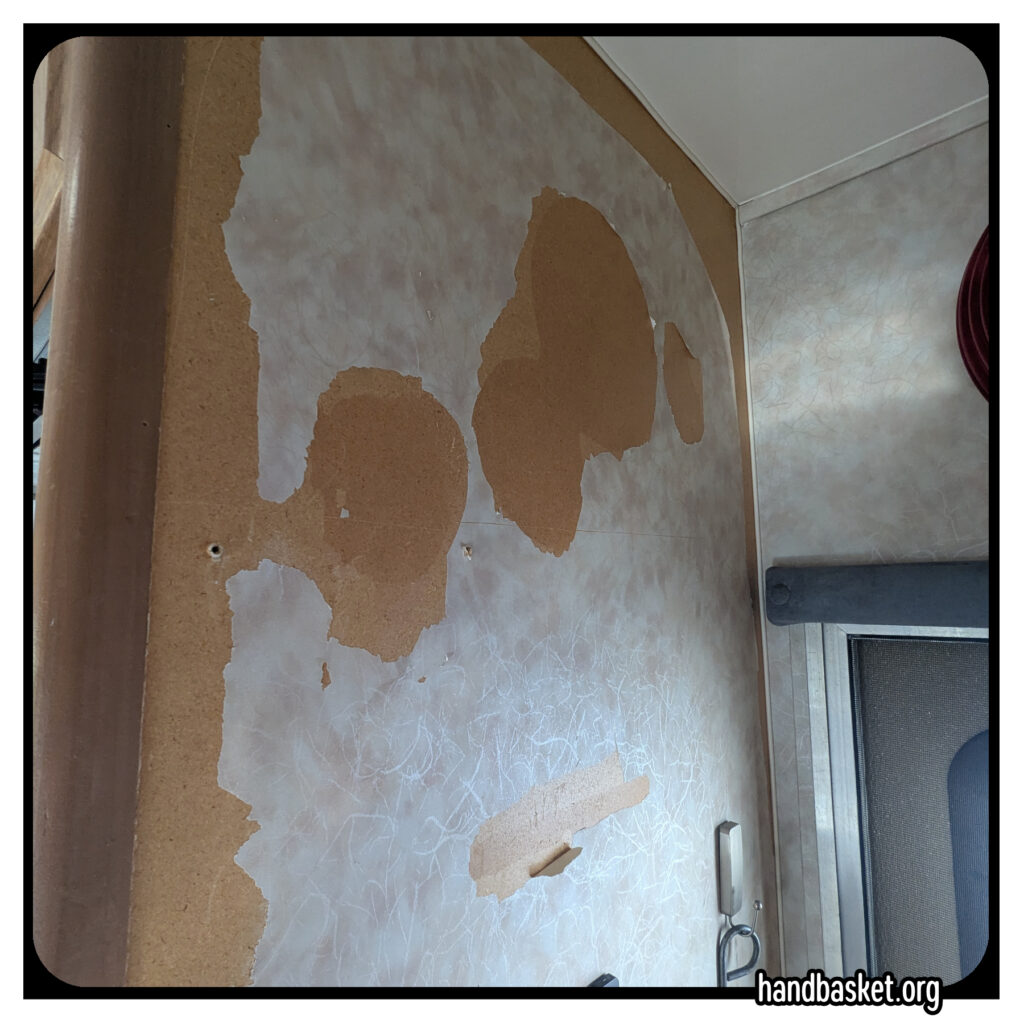 Snapshot of RV wall with patchy wallpaper